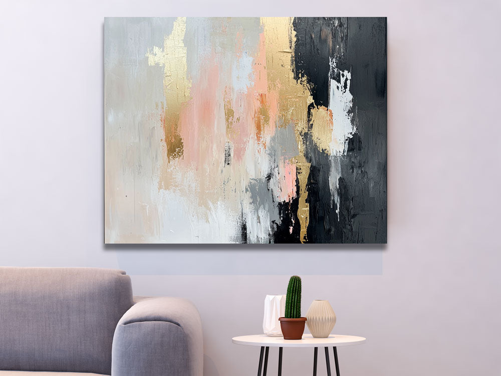 Canvas wall art with soft tones and gold accents above white table