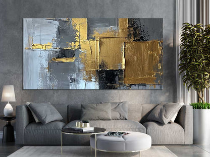 Modern living room with abstract gold and grey canvas wall art