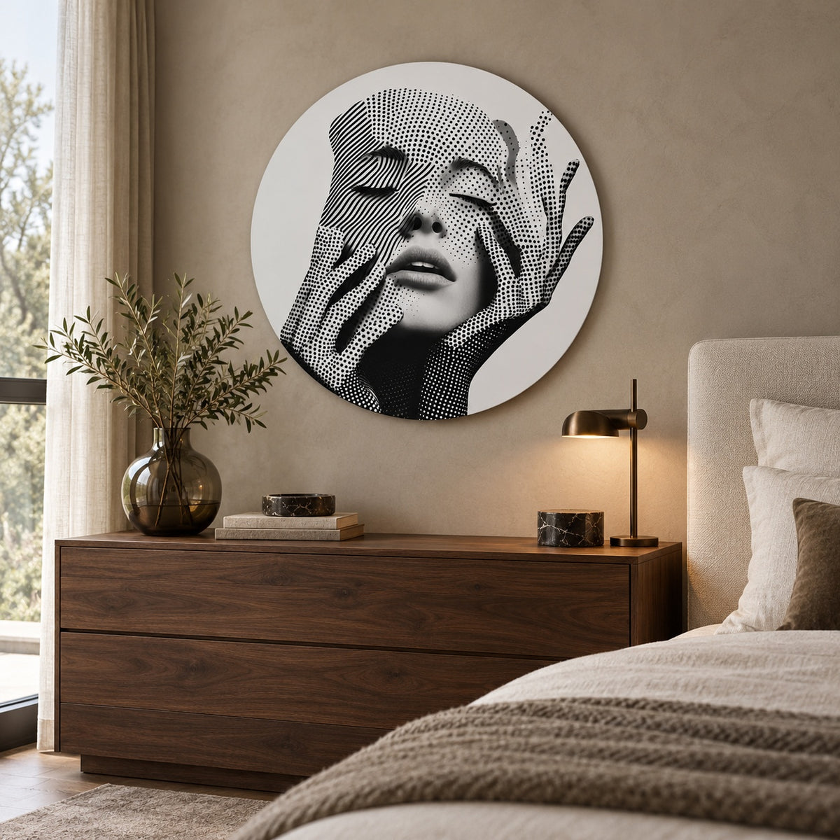 Round aluminium portrait print displayed above a walnut chest in a bedroom