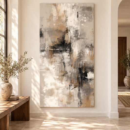 Canvas print with charcoal, taupe, and ivory brushstrokes displayed above a walnut bench in an entryway