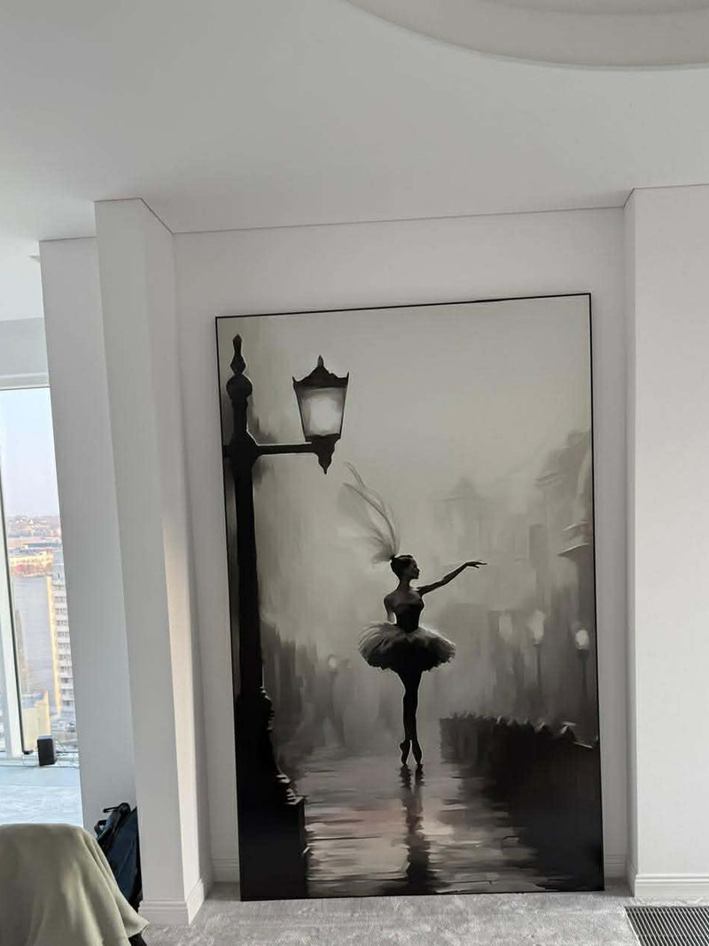 Large wall art of a ballerina under a street lamp in a modern room.