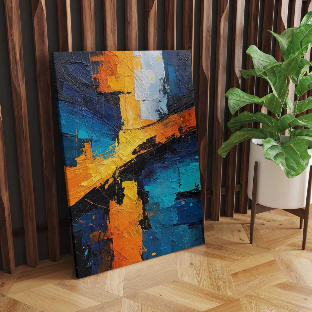 Modern canvas artwork leaning against wooden wall