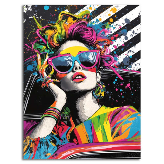 Chromatic Drive canvas print — colourful pop-art portrait of a woman with rainbow hair, pink cat-eye sunglasses and colourful bracelets, leaning out of a car window against a black and white striped background with paint splatters