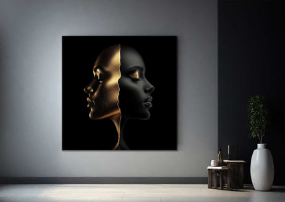 Minimal black and gold face artwork on metal against grey wall