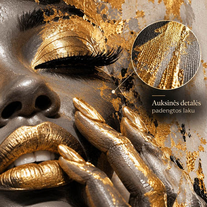 Close-up of gold-toned lacquer details coated with glossy varnish on the canvas surface