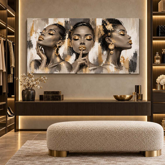 Gold-accent three-women portrait canvas print displayed in a walk-in closet above a console table