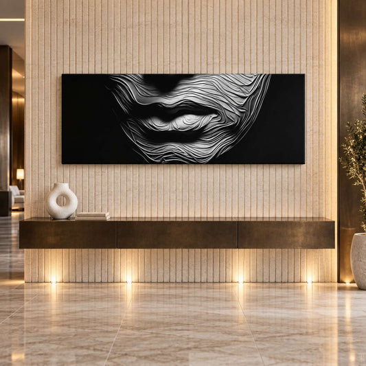 Black and white textured lips canvas print displayed above a floating console in a warm wood-panelled hallway