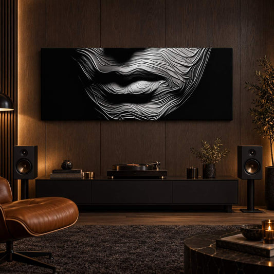 Black and white textured lips canvas print displayed above a media console with a turntable in a cozy den