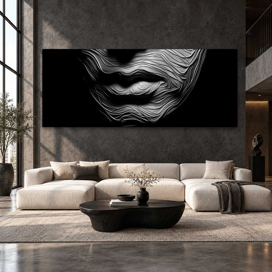 Black and white textured lips canvas print displayed beside a curved marble staircase