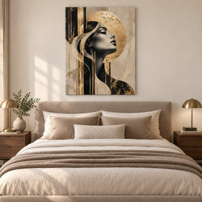 Abstract gold and black portrait canvas print displayed above a bed in a warm neutral bedroom